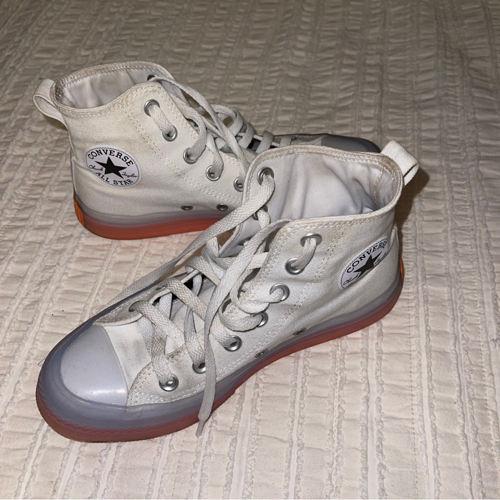 White and pink stretch converse